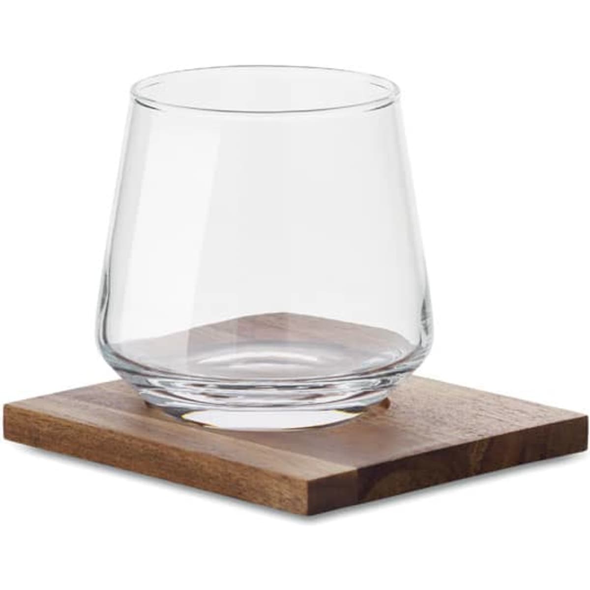 A clear glass tumbler sits on a wooden coaster. The glass has a modern design and a rounded shape.