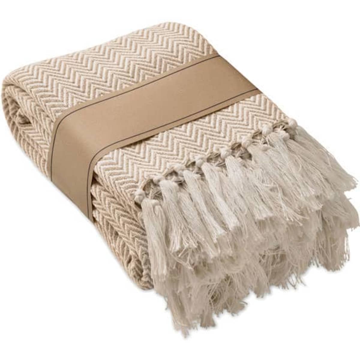A folded blanket in a chevron pattern, featuring a cream colour with fringed edges and a brown band.