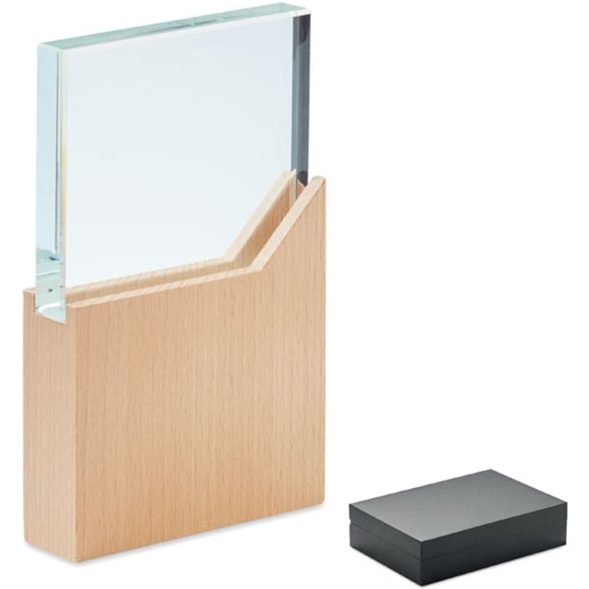 A clear glass display piece sits in a wooden base, accompanied by a black box, showcasing a modern design.