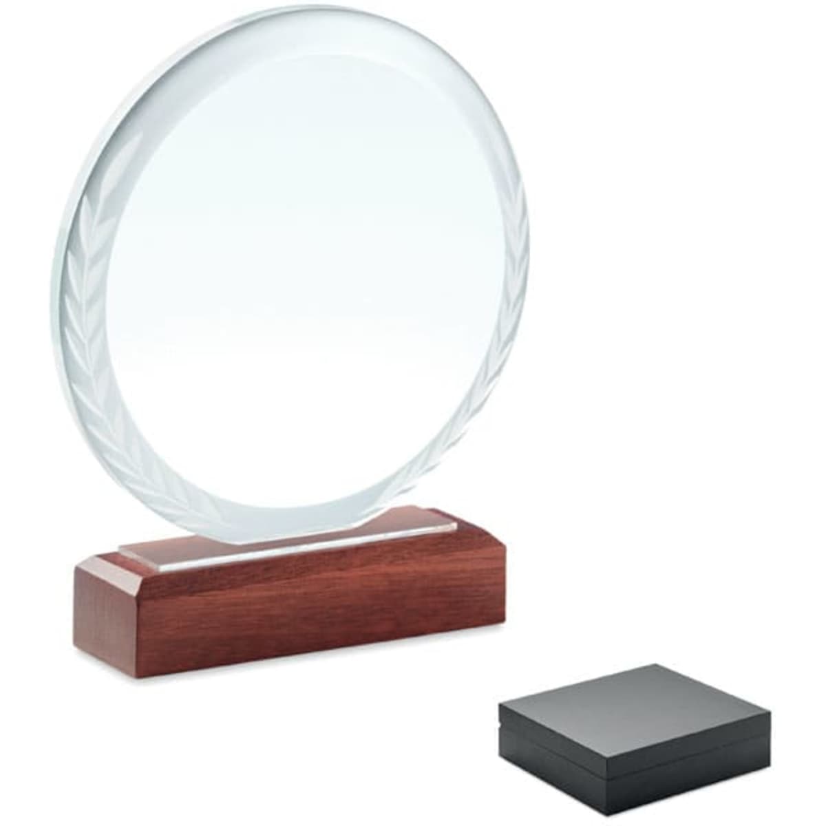 A circular clear crystal award on a brown wooden base, accompanied by a black gift box.