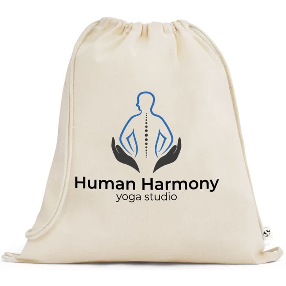A cream drawstring bag made of 100% organic cotton featuring a logo and design related to a yoga studio.