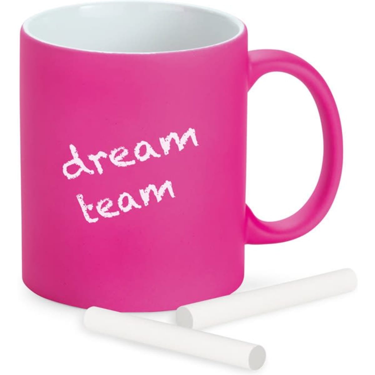 A pink ceramic mug with a white interior and chalk-like writing. It includes two white chalk pieces.