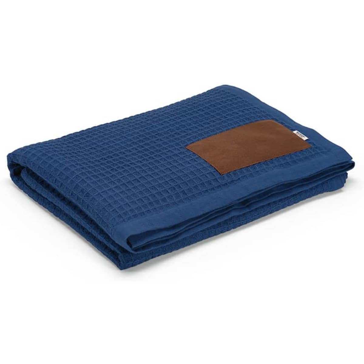 A folded blue blanket with a textured fabric and a customisable brown patch. It features a logo on the patch.