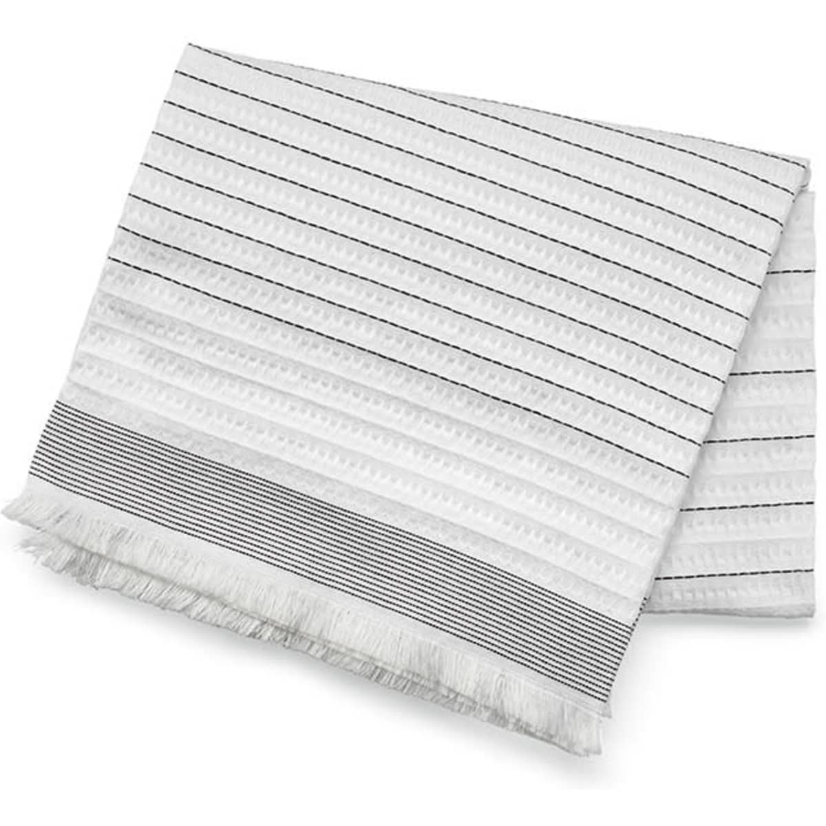 A cotton blanket with a textured white surface and dark striped pattern, featuring fringed edges.