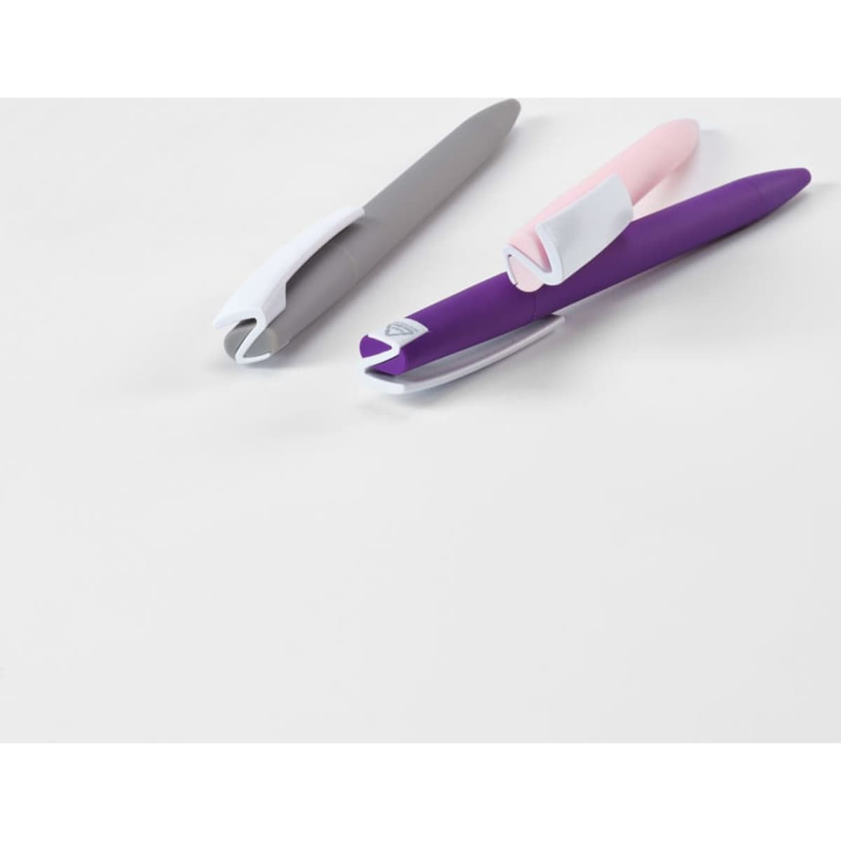 Two pens with purple and pink accents, featuring a sleek design and a logo on one pen.