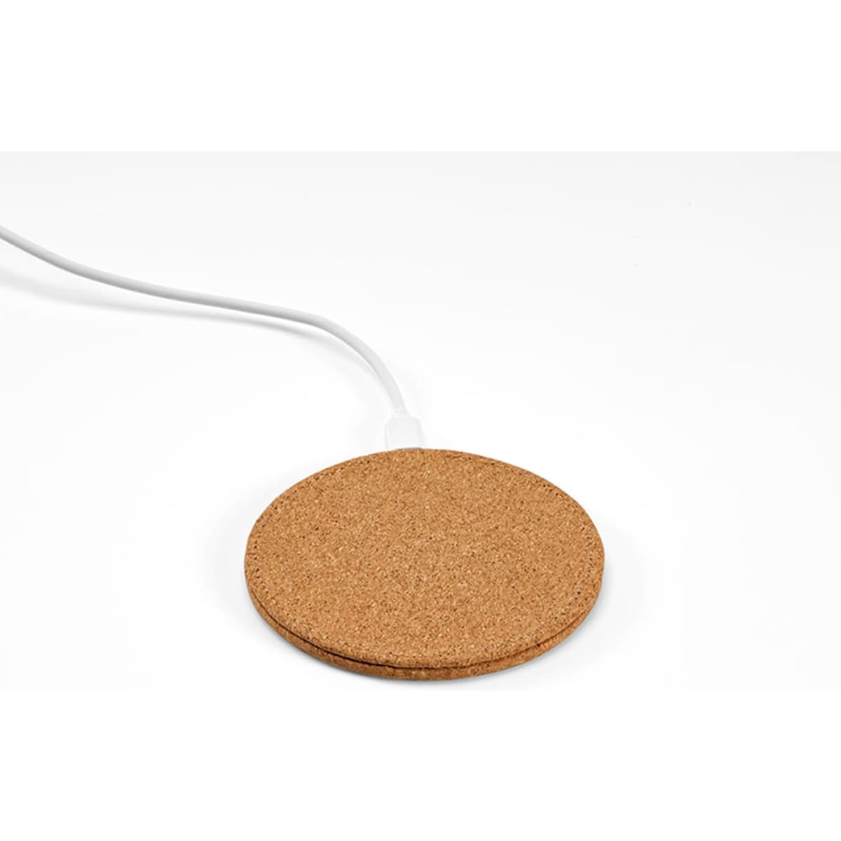 A round, cork wireless charger with a white USB-C cable, set against a plain background.