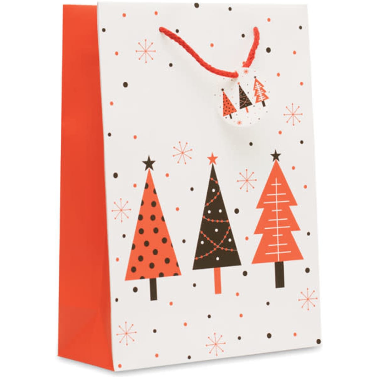 A Christmas gift bag featuring red, black, and white designs of decorated trees and snowflakes, with a matching tag.