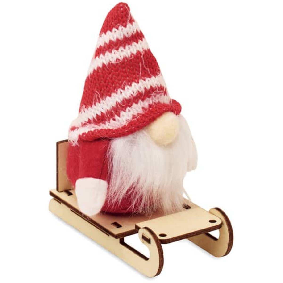 A decorative gnome with a striped red hat sitting on a wooden sleigh. Features white beard and felt accents.