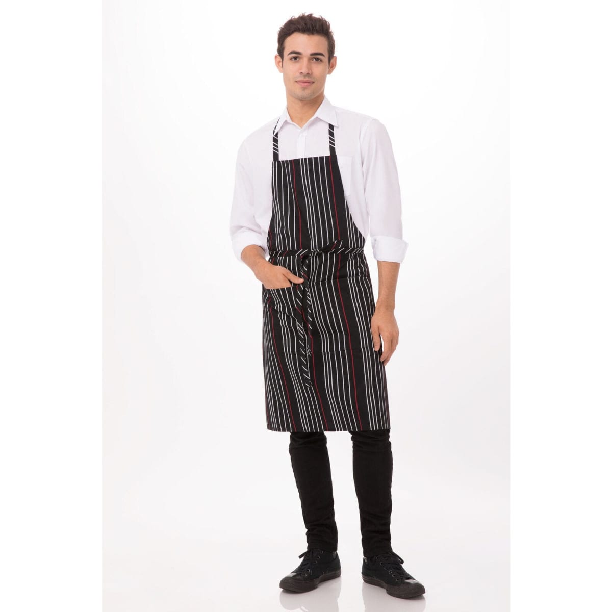 A man wearing a black and white striped bib apron with a pocket, paired with a white shirt and black pants.