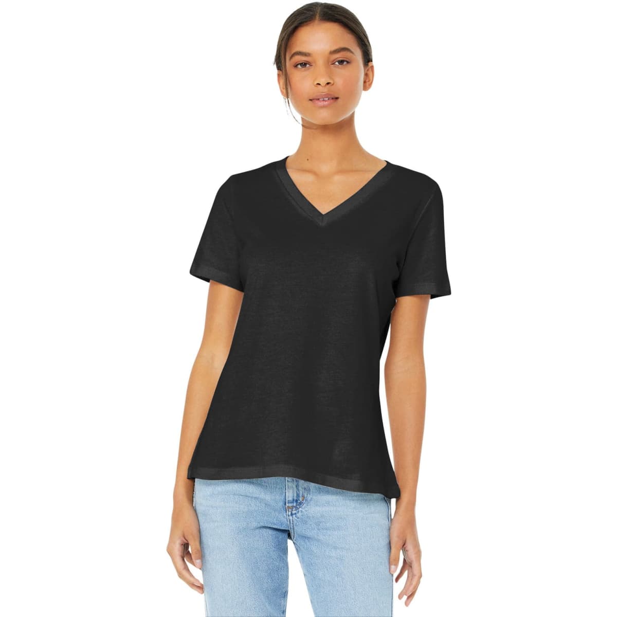 A woman wearing a black relaxed jersey short sleeve V-neck tee, paired with light blue jeans. The tee features a logo.