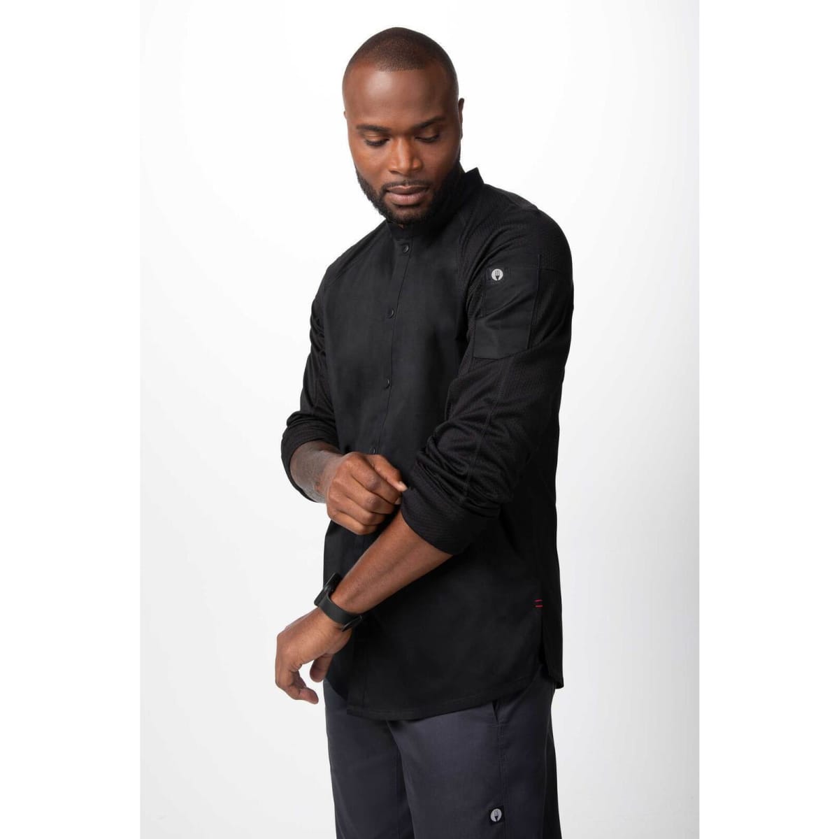 A black men's chef jacket featuring long sleeves and a subtle logo, designed for culinary professionals.