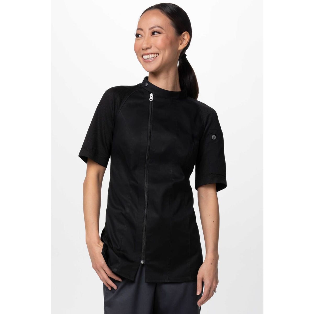 A black women's chef jacket with short sleeves and a zip front, featuring a logo.