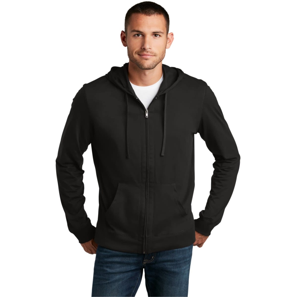 A young man wearing a black zip-up hoodie with a front pocket and drawstrings. The hoodie has a logo visible.