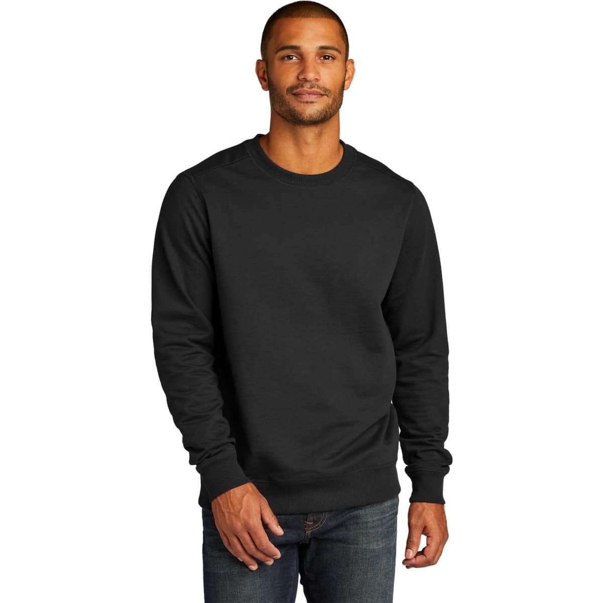 A black crew sweatshirt worn by a man, featuring long sleeves and a relaxed fit. It has a logo on the front.