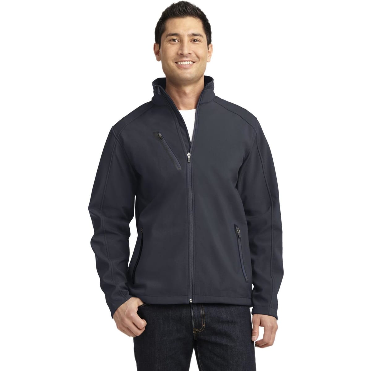 A man wearing a navy blue Port Authority Welded Soft Shell Jacket with a zippered front and pockets.