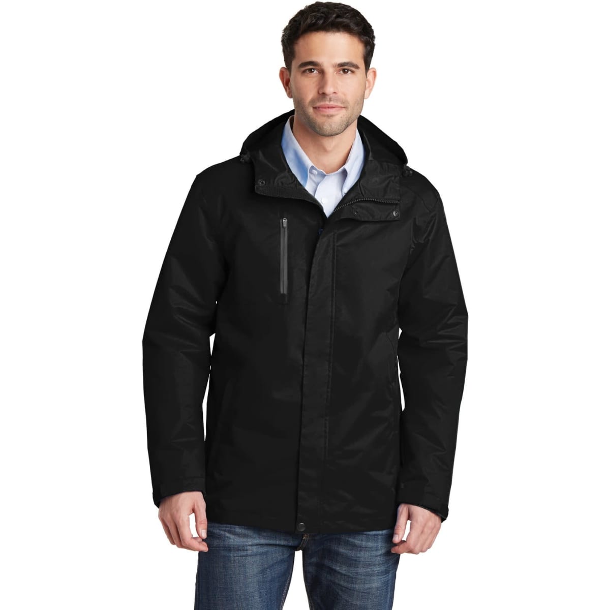 A black rain jacket with a hood and zippered pockets, featuring a logo. Worn by a man standing casually.