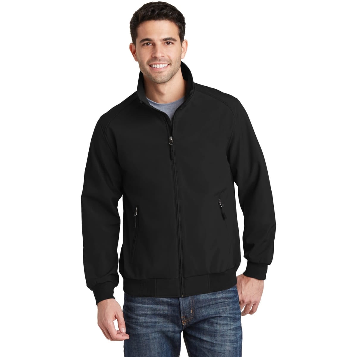 A black soft shell bomber jacket with a zip front and side pockets, worn by a man in casual attire.