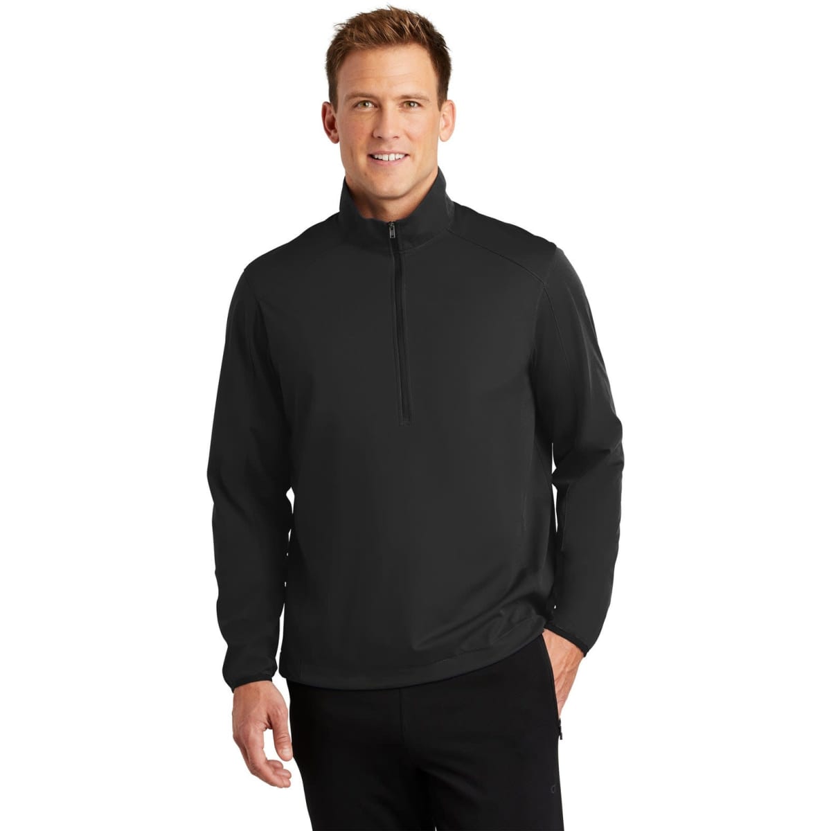 A black soft shell jacket with a half-zip design, featuring a stand-up collar and long sleeves.