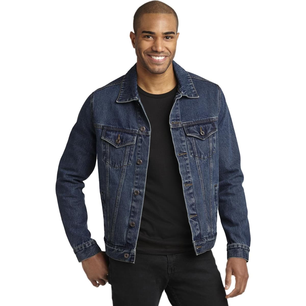 A denim jacket in dark blue, featuring button closure and two front pockets, worn by a smiling male model.