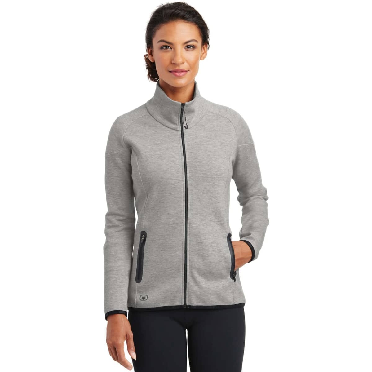 A grey ladies' jacket featuring a zip front, high collar, and side pockets, with branding on the lower side.