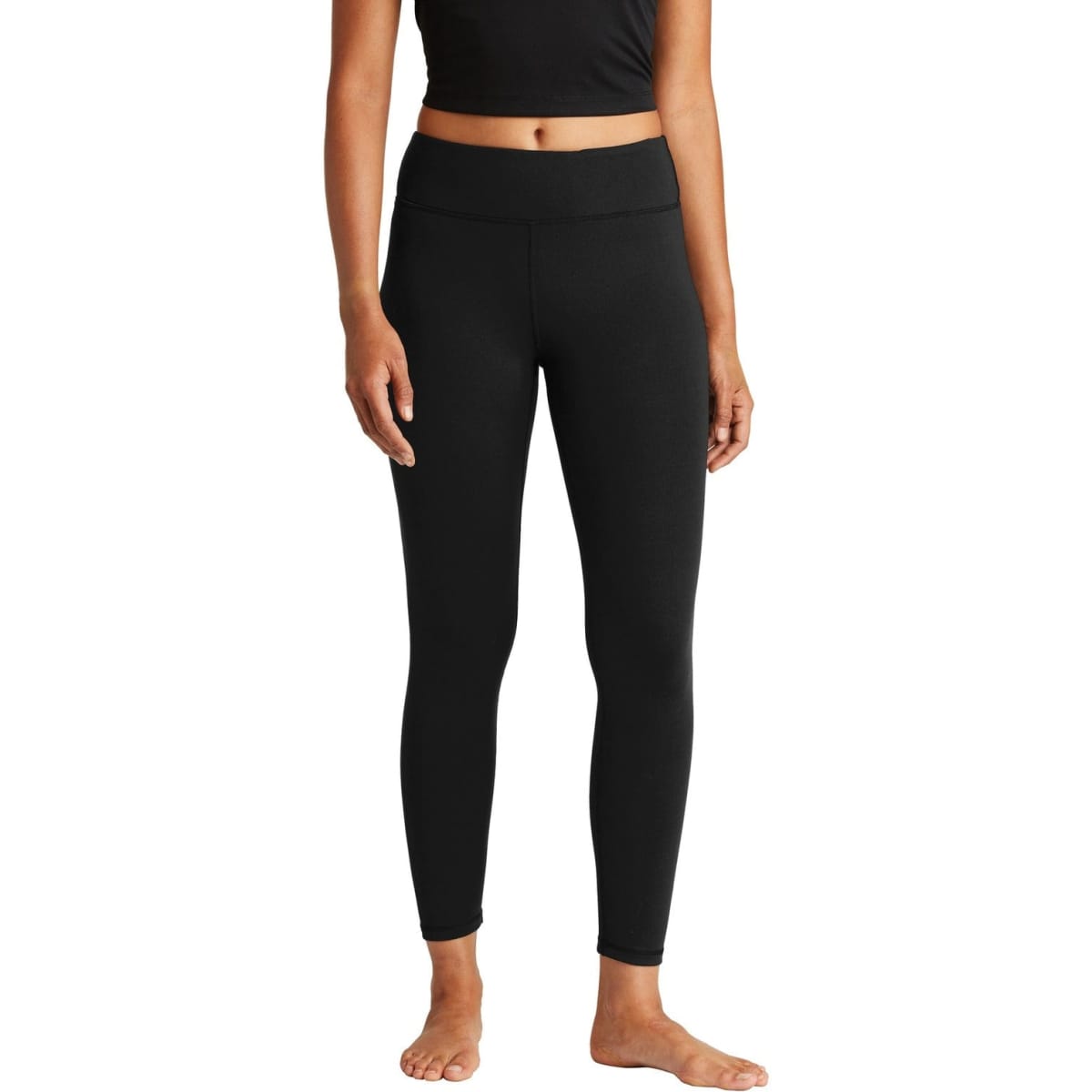 A pair of black 7/8 leggings for ladies, featuring a fitted design and a waistband. It has a logo.