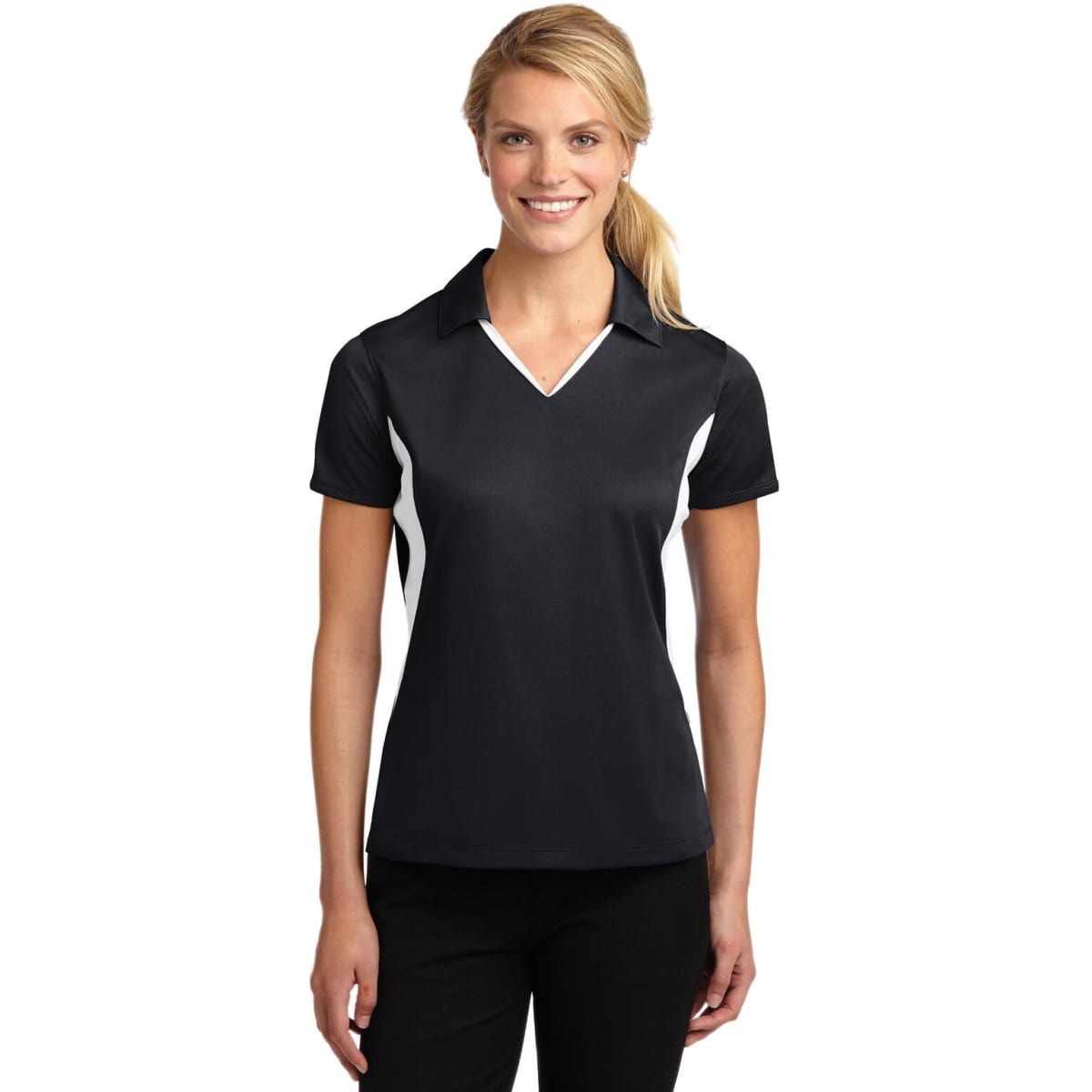 A black polo shirt with white side panels, featuring a collar and a fitted design, displayed on a model.