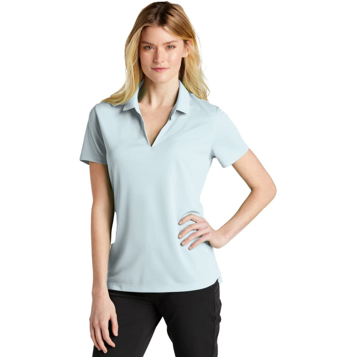 A light blue ladies' polo shirt with a collar and a logo, displayed on a female model.