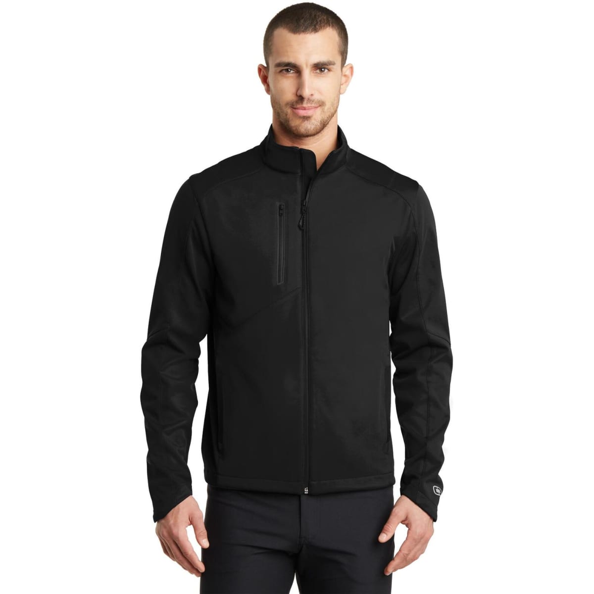A black OGIO ENDURANCE Crux Soft Shell jacket featuring a sleek design and a logo on the sleeve.