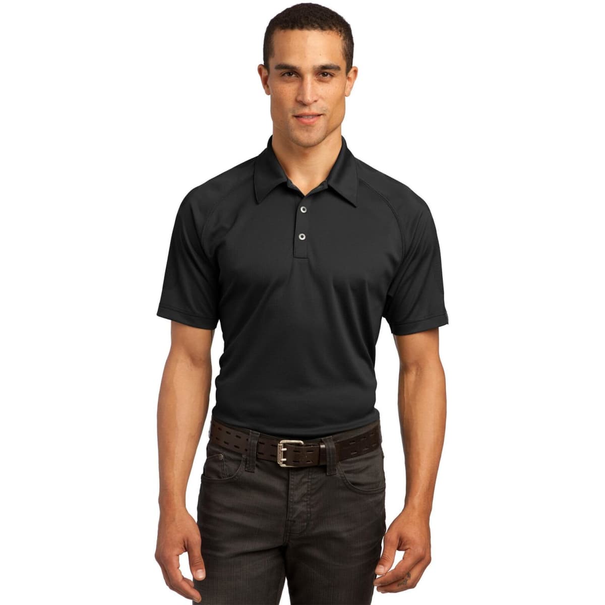A black OGIO Optic Polo shirt on a male model, featuring a collar and branding. Suitable for casual or professional wear.