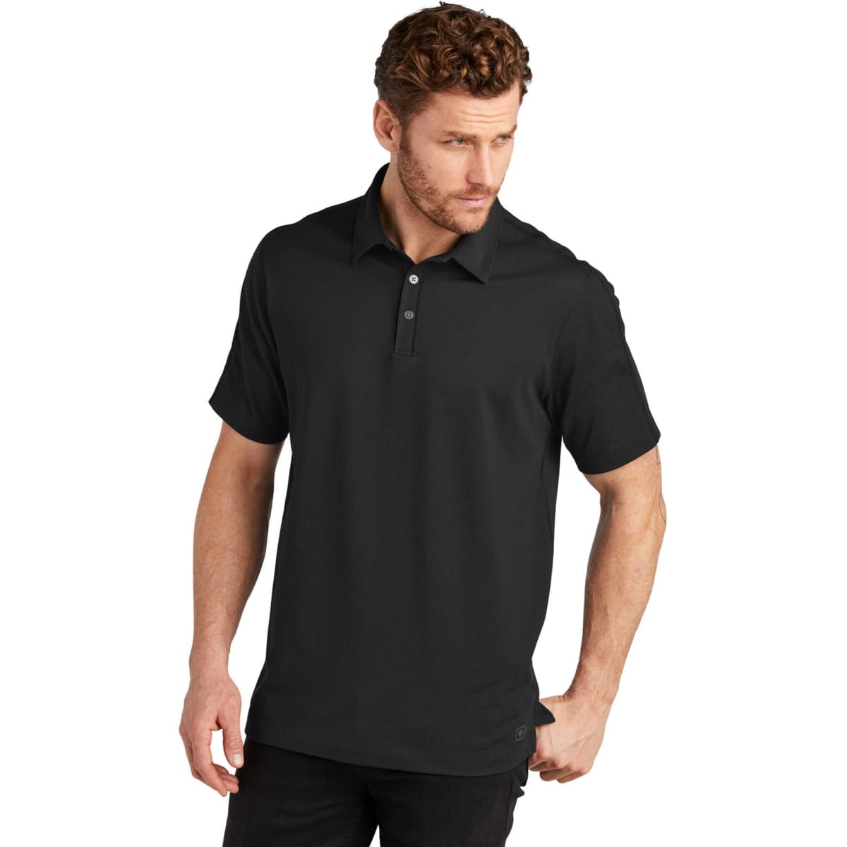 A black polo shirt with a collar and a logo. It has short sleeves and a relaxed fit.