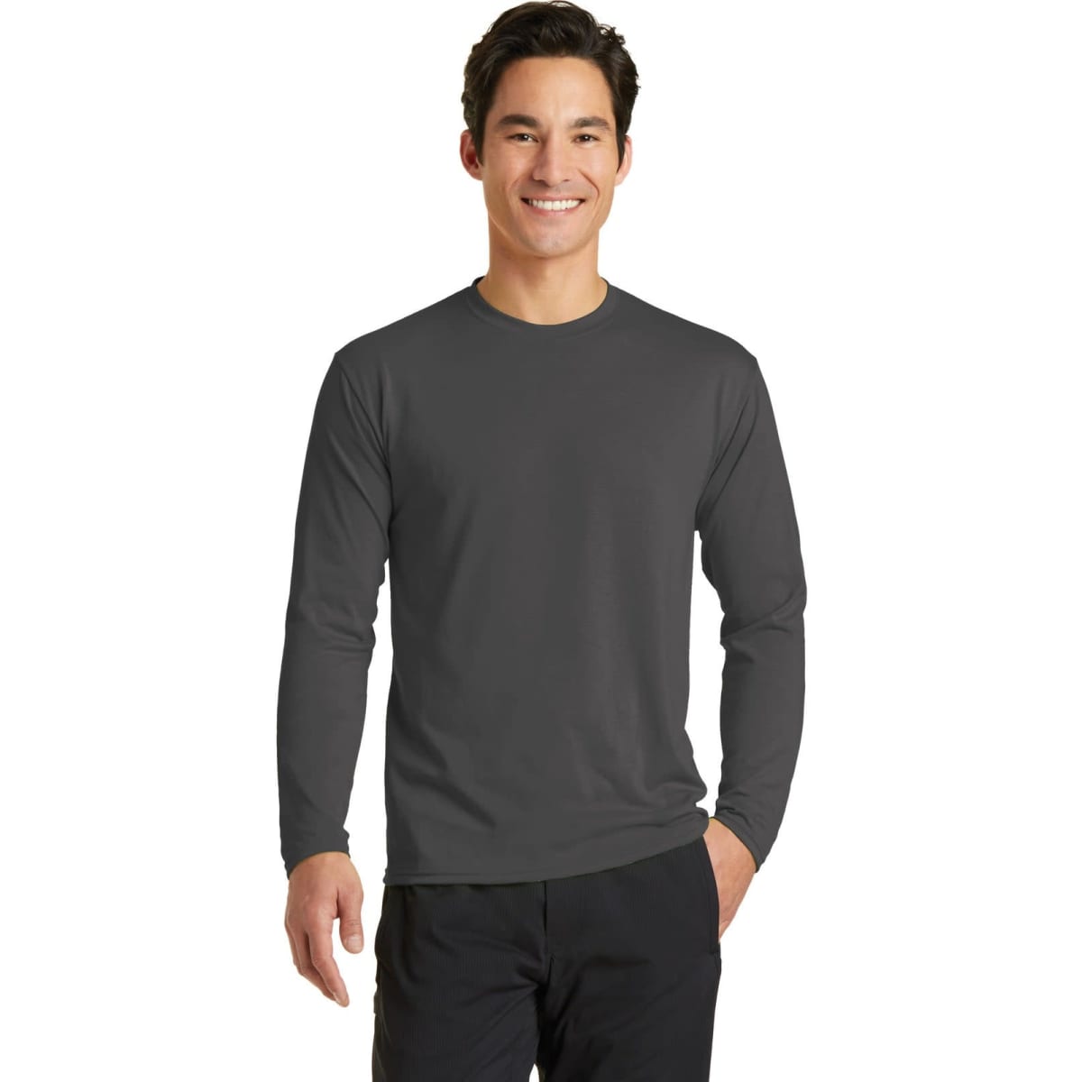 A long sleeve performance blend tee in dark grey, featuring a simple design and a logo.