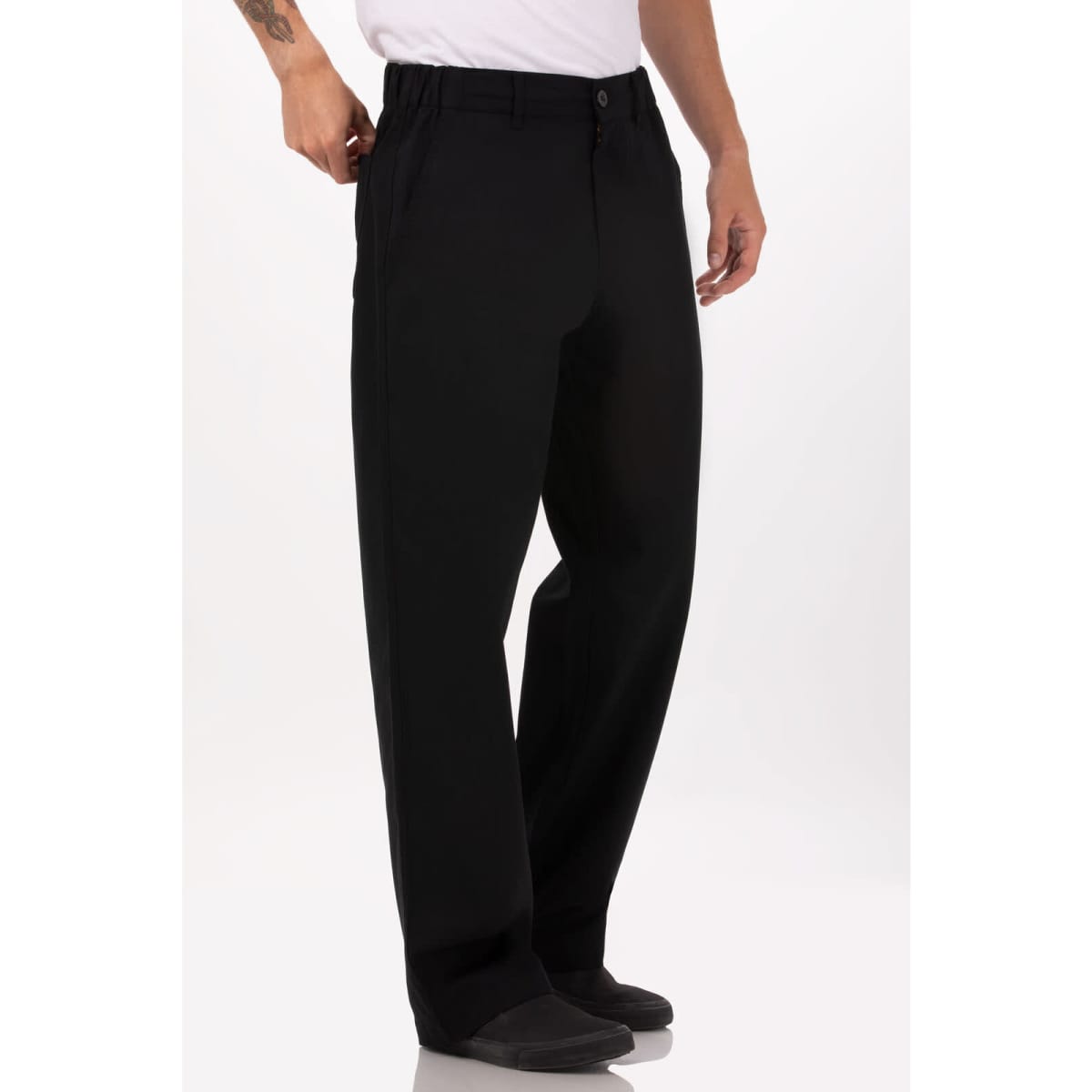 Black chef pants with a relaxed fit and a button closure, featuring pockets and a logo on the waistband.