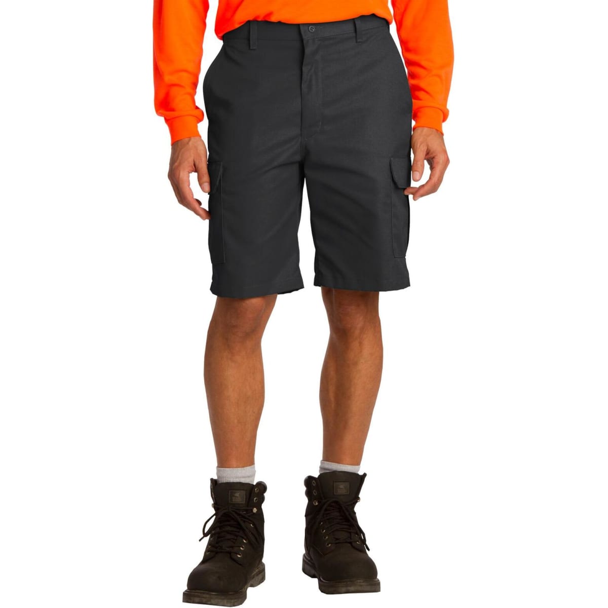 A man wearing grey cargo shorts with side pockets, paired with an orange long-sleeve shirt and brown boots.