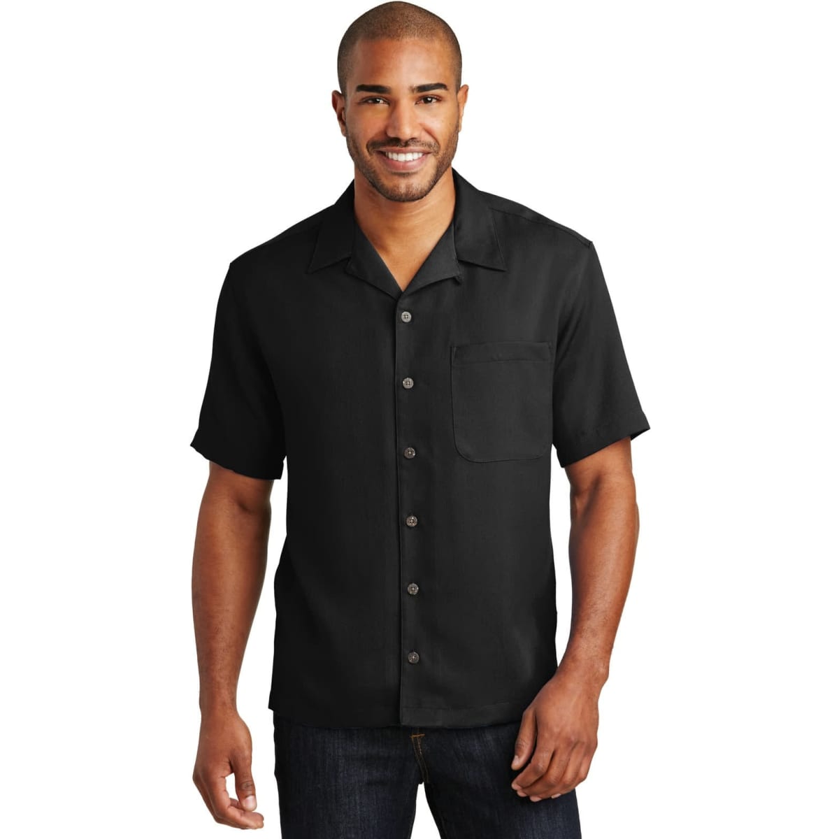 A man wearing a short-sleeved, black button-up shirt with a pocket and a logo on the chest.