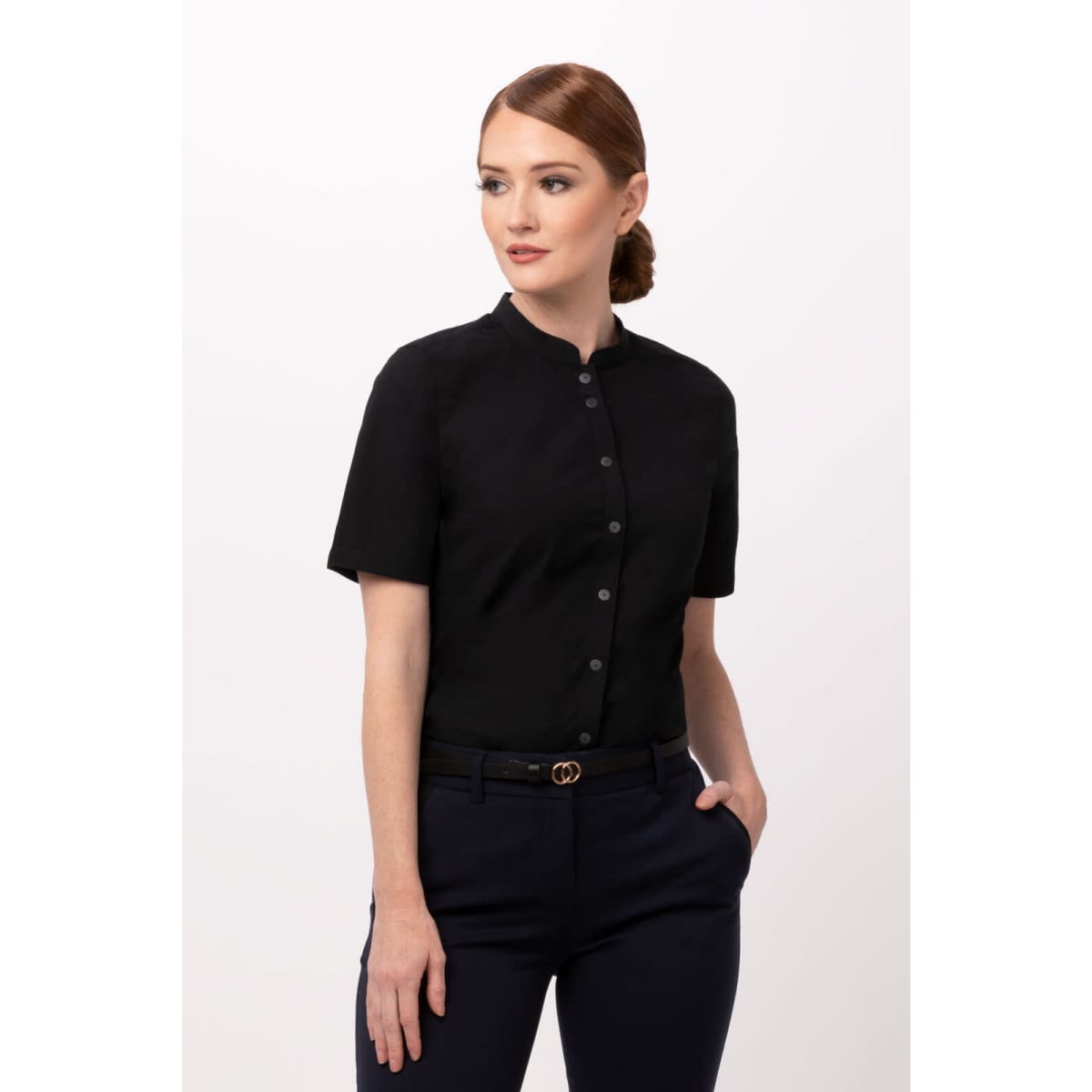 A black button-up women's shirt featuring short sleeves and a minimalist design. The shirt has a logo on the label.