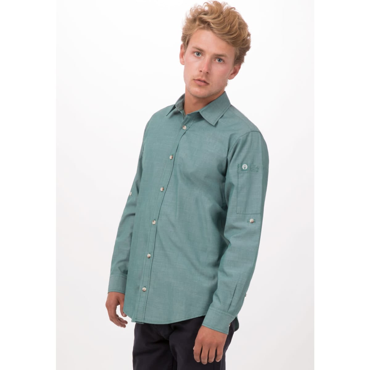 A chambray button-up shirt in a light blue-green colour, featuring a logo and long sleeves.