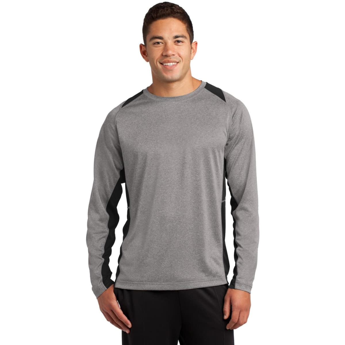 A person wearing a grey long sleeve T-shirt with black accents and a logo.
