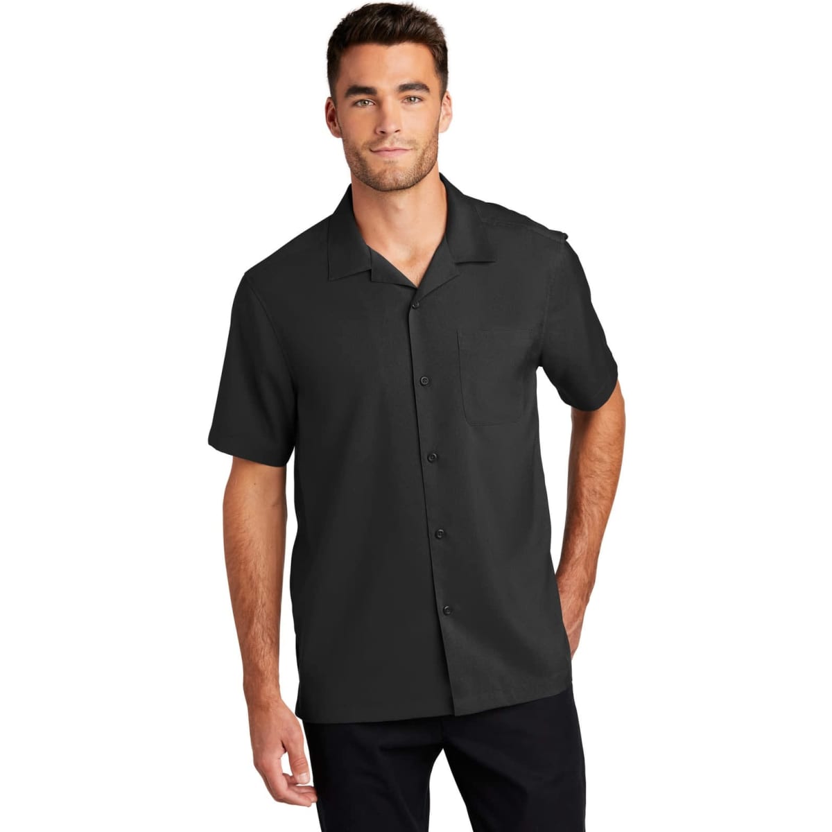 A short-sleeve performance staff shirt in black, featuring a button-up front and a collar, with a logo present.