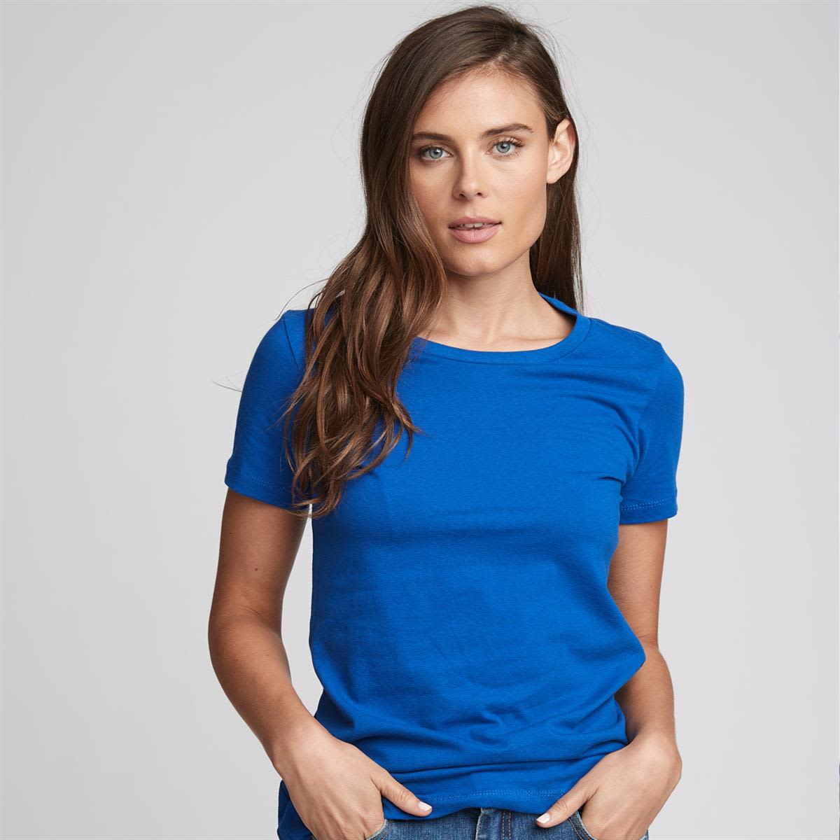 A woman wearing a fitted blue t-shirt, styled with a round neckline and short sleeves. The t-shirt features a logo.