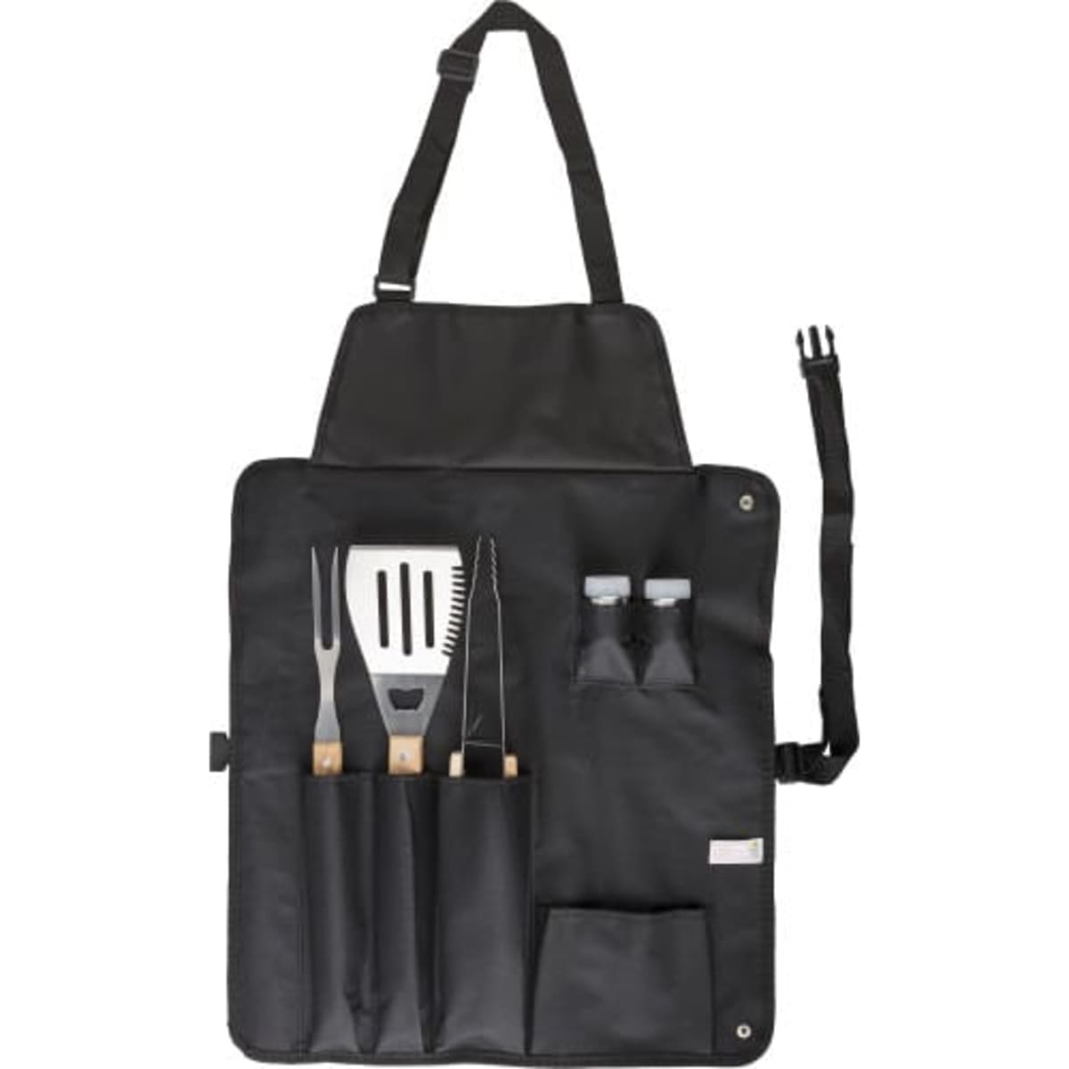 A black barbecue apron with wooden-handled utensils including a spatula, tongs, and a grill fork, plus spice containers.