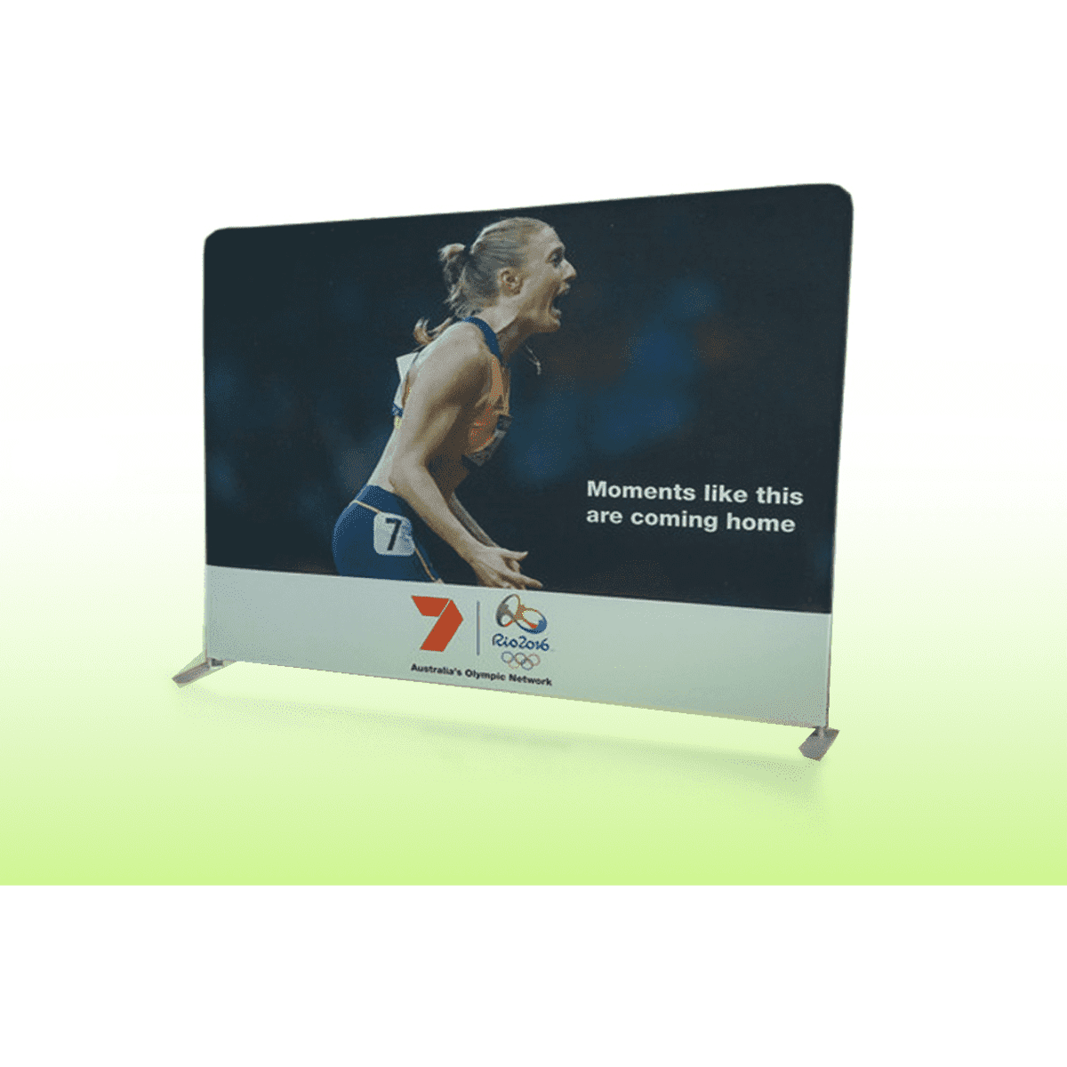 A display banner wall featuring a vibrant photo of an athlete, with a logo at the bottom.