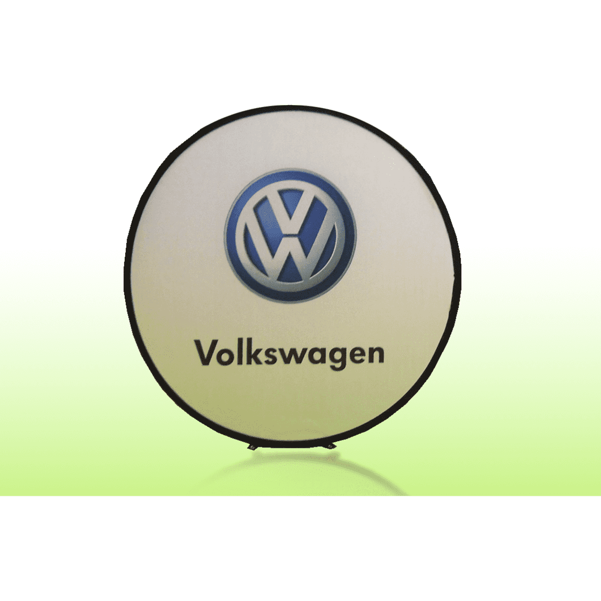 A large round A-frame banner featuring a logo on a white background with a black border. The background is a gradient green.
