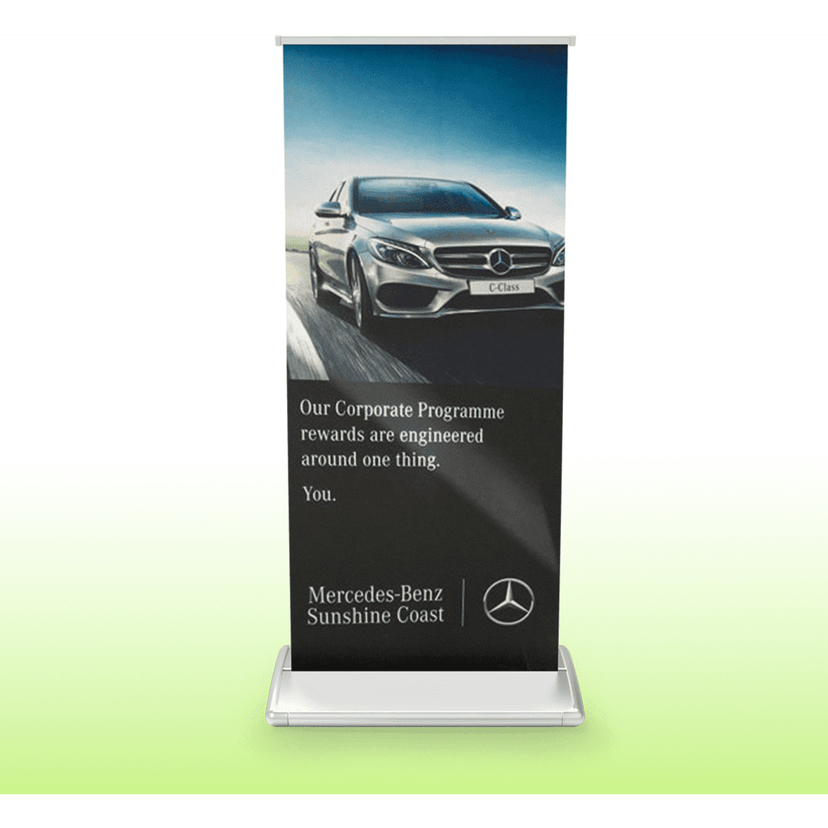 A pull-up banner featuring a car image and branding, predominantly in shades of black and white, with a silver base.