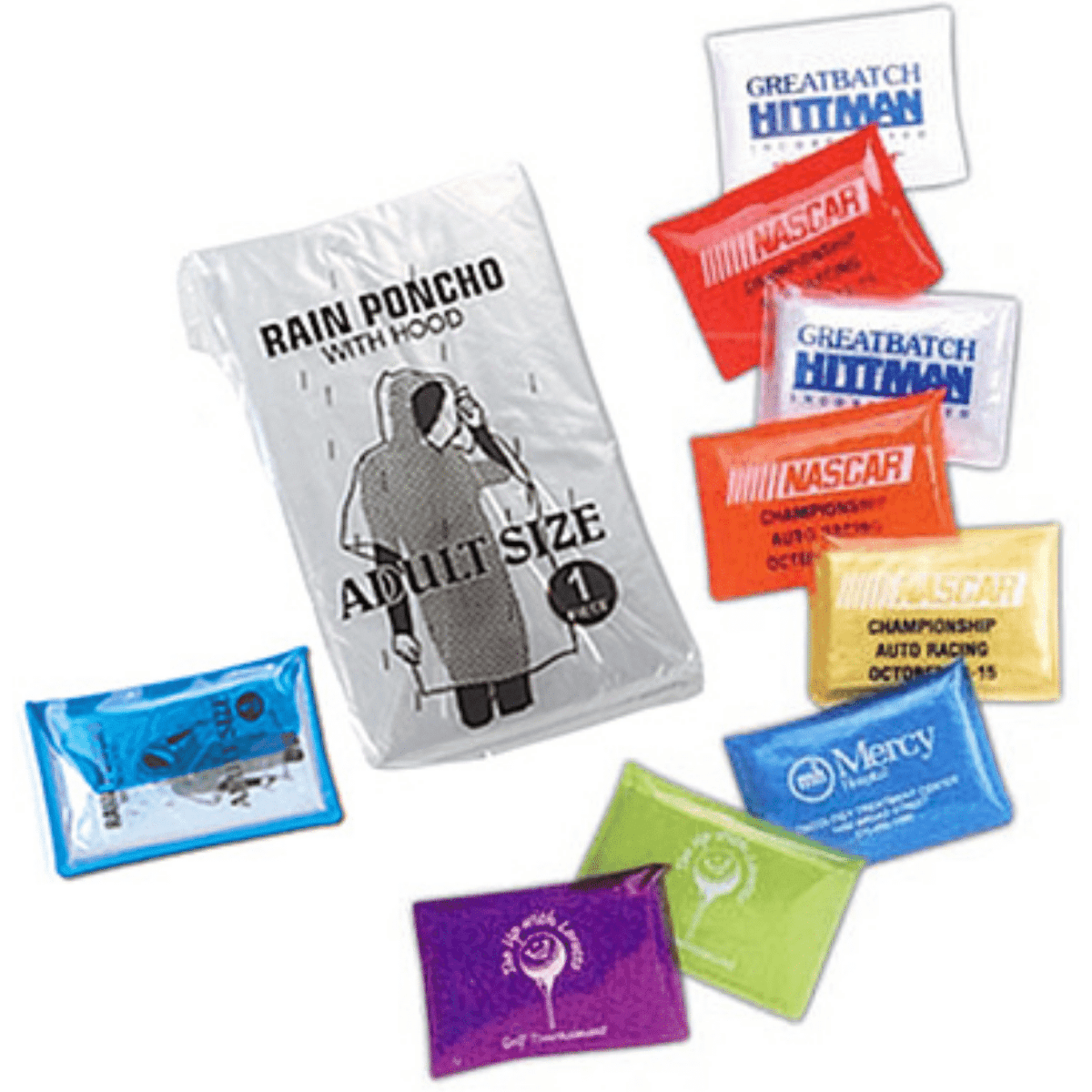 A clear package containing an adult-sized rain poncho, with assorted colourful packets nearby, featuring logos.
