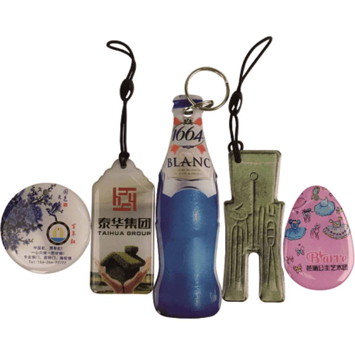 A collection of custom epoxy dome key tags in various shapes and colours, featuring a logo on one tag.