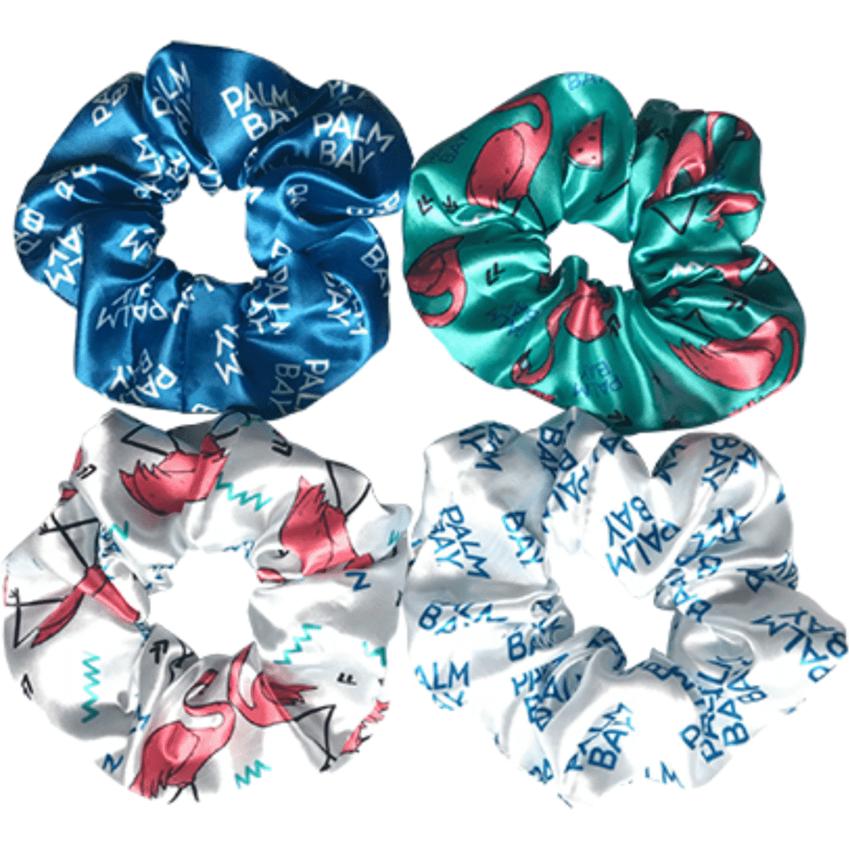 A set of four scrunchies in blue, white, and pink, featuring various patterns and designs with branding.