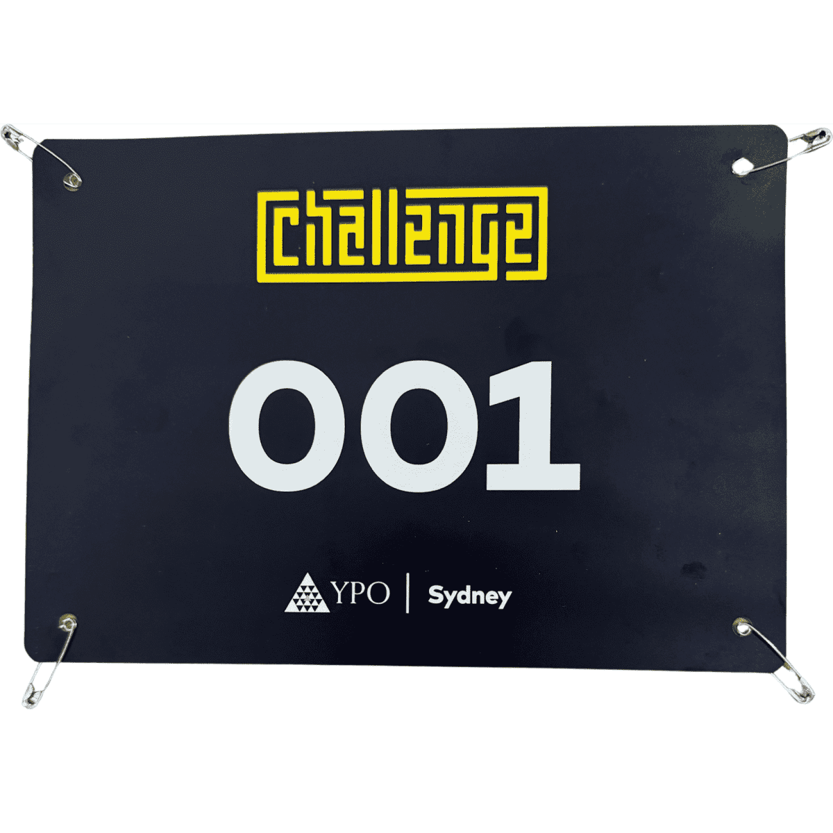 A black sports bib with the number 001, featuring a logo and four attached pins.
