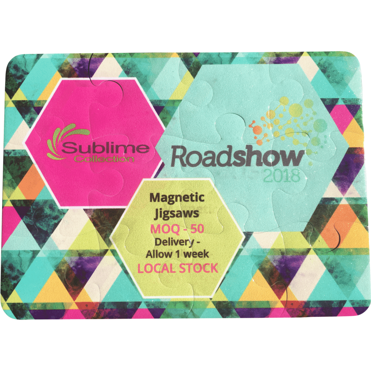 A magnetic jigsaw puzzle with 12 pieces featuring vibrant geometric patterns in pink, green, and blue.
