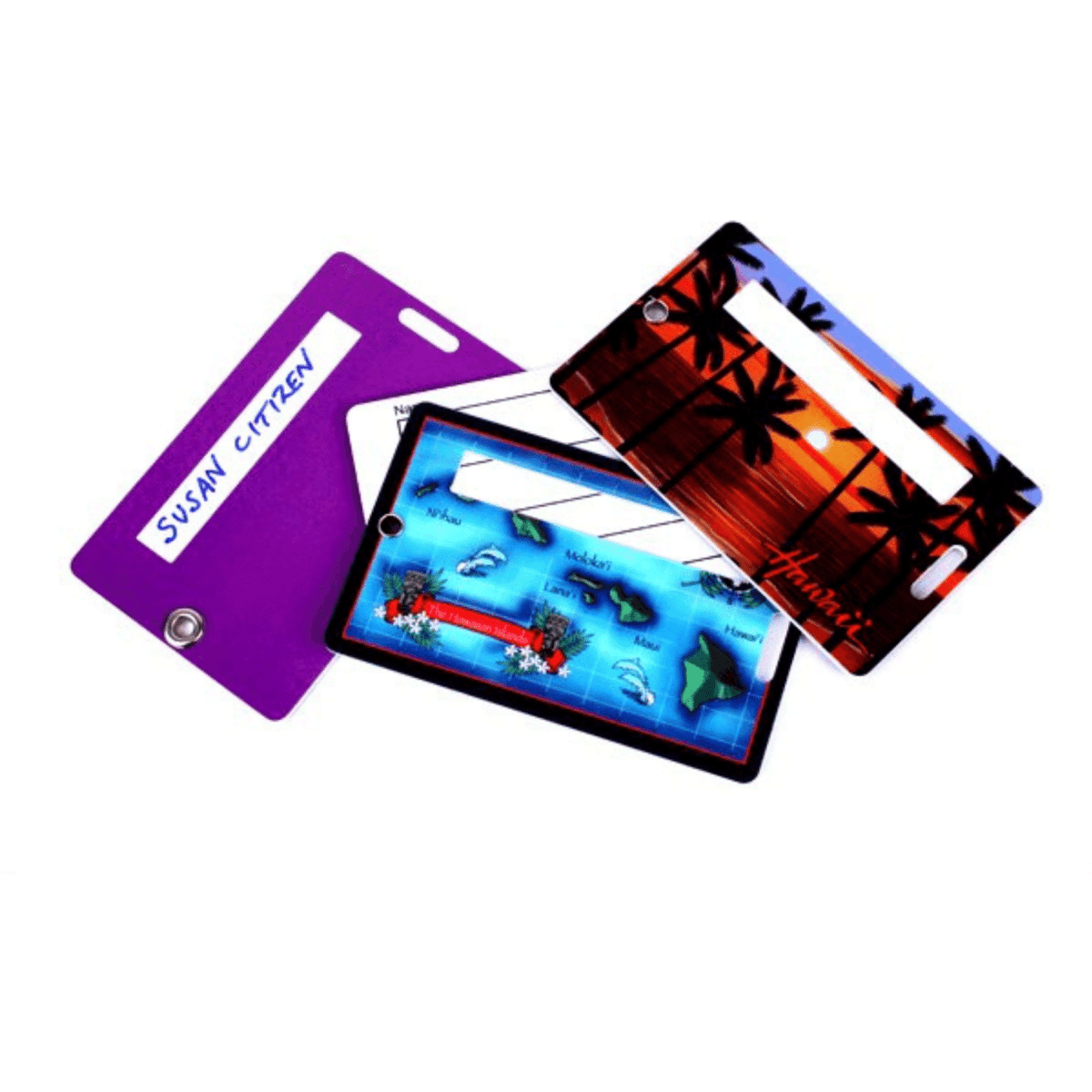A set of plastic luggage tags in purple and colourful tropical designs, featuring an eyelet and address panel.