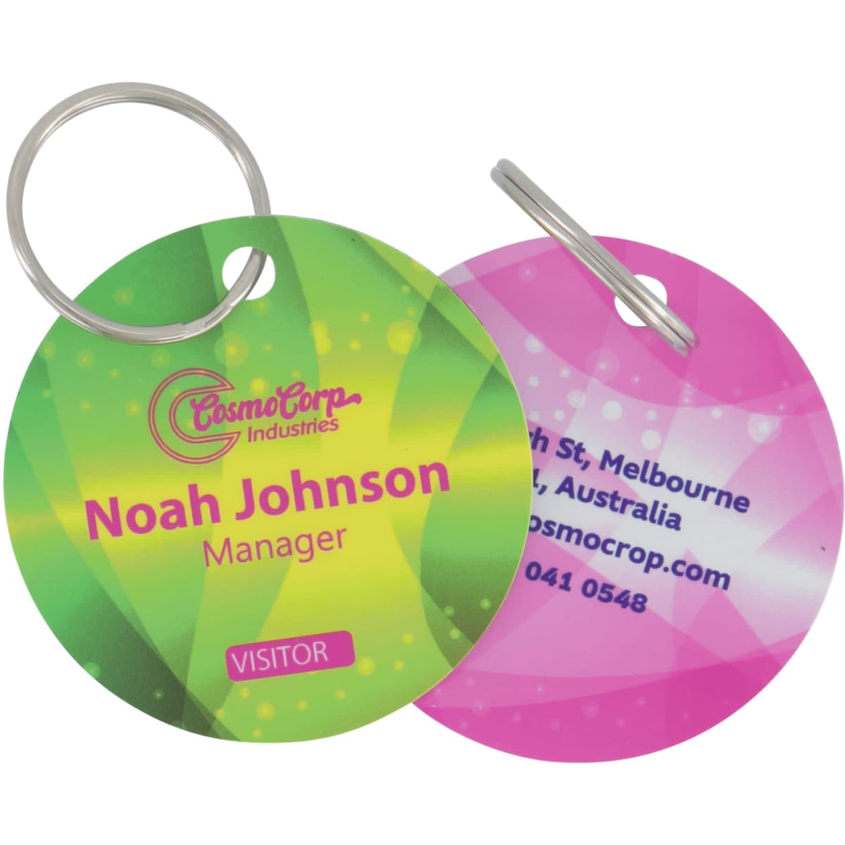 A double-sided keyring with a 50mm round hole, featuring vibrant green and pink designs, and a logo.
